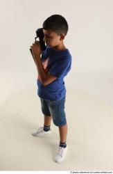 TIMBO STANDING POSE WITH GUN